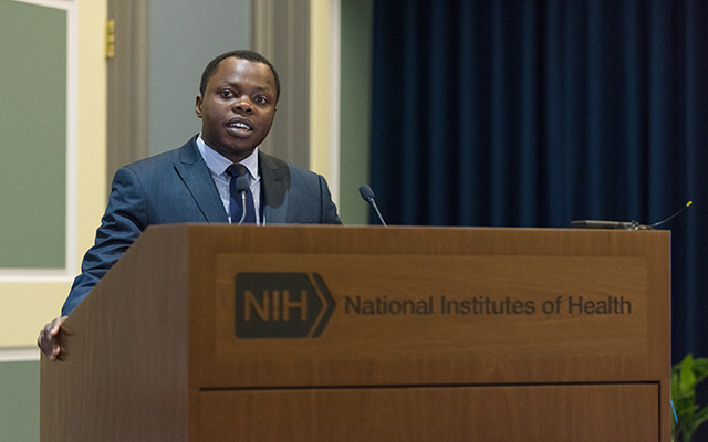 Dr. Jean Nepo Utumatwishima, the first graduate of the yearlong NIH Rwanda fellowship program, delivers his graduation presentation, June 26, 2017