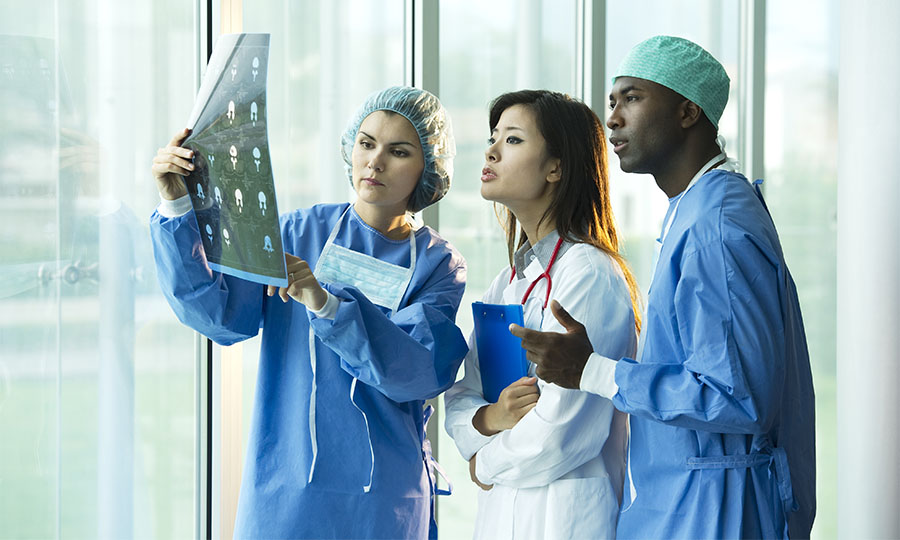 Medical professionals viewing a scan.