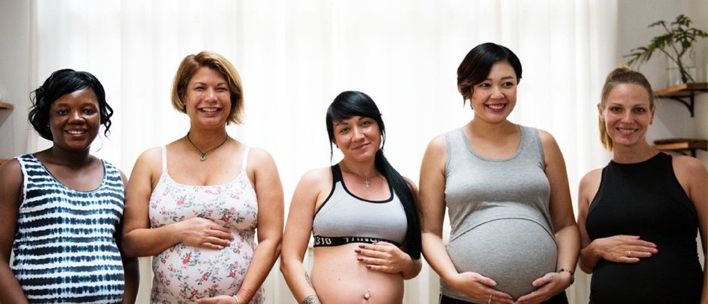 Group of pregnant women standing together